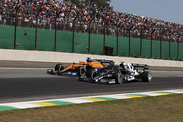 Action. Daniel Ricciardo, McLaren MCL35M, battles with Pierre Gasly, AlphaTauri AT02