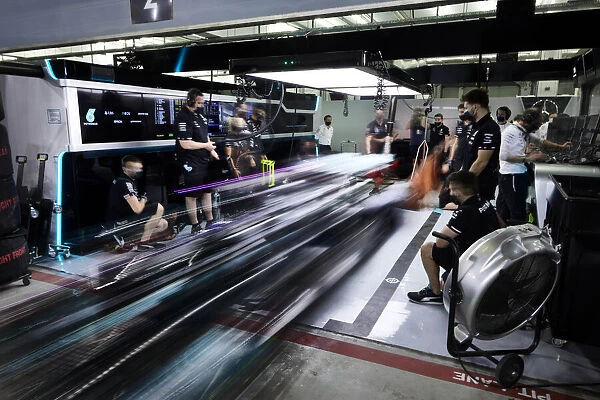 Action Portrait. Sir Lewis Hamilton, Mercedes W12, leaves the garage