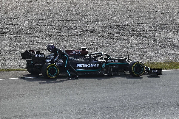 Helmets portrait. Sir Lewis Hamilton, Mercedes, attends his car after a break down in FP2