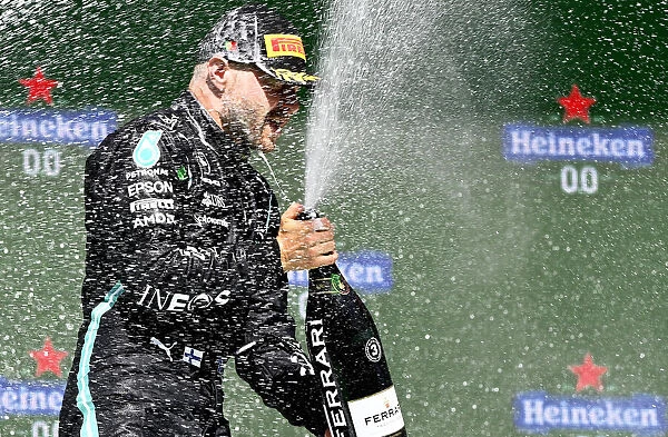 Podium Portrait. Valtteri Bottas, Mercedes, 3rd position, sprays Champagne on the podium