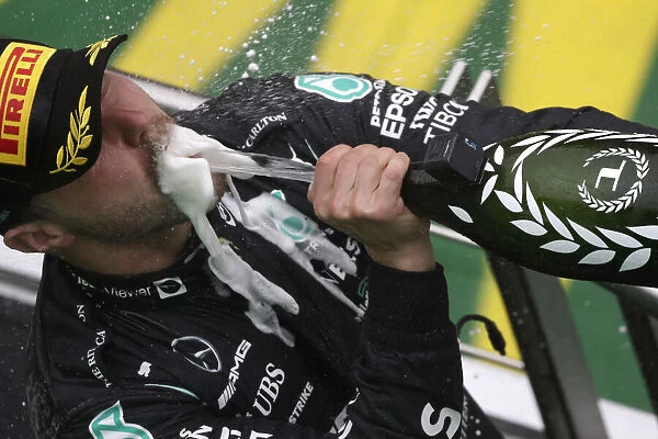 Portrait Podium. Valtteri Bottas, Mercedes, 1st position, sprays the victory Champagne